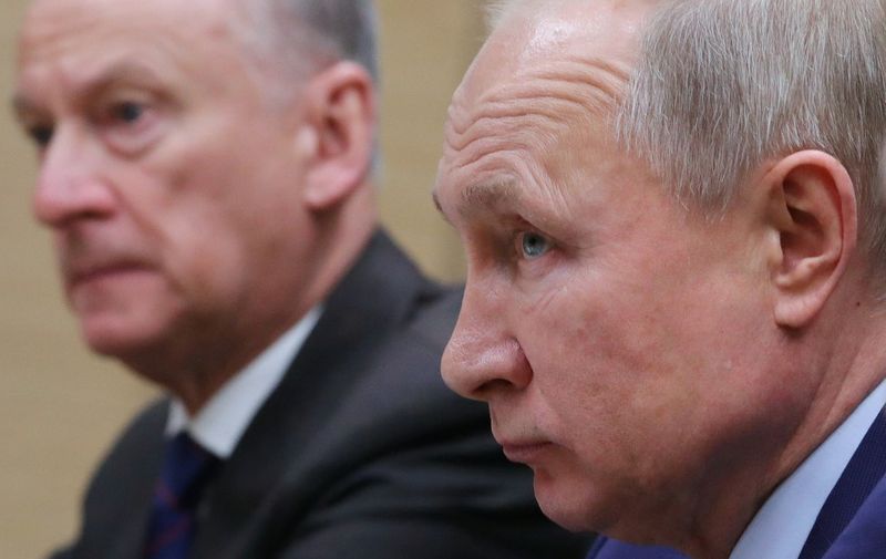 Russian President Vladimir Putin, accompanied by Secretary of Russia's Security Council Nikolai Patrushev, meets with secretary general of Japan's National Security Council at the Novo-Ogaryovo residence outside Moscow on January 16, 2020. (Photo by Mikhail KLIMENTYEV / SPUTNIK / AFP)