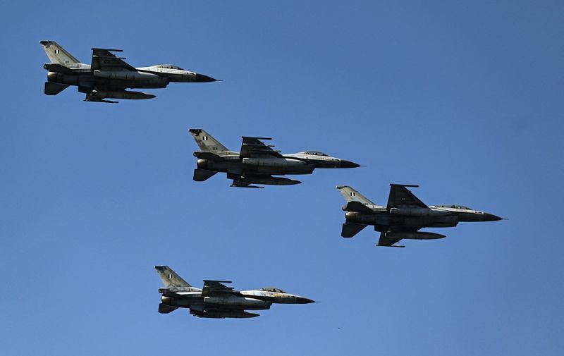 Hellenic Air Force F-16 fighter jets fly during a military parade to mark National "Oxi" (No) Day in Thessaloniki on October 28, 2023, commemorating Greece's refusal to accept the ultimatum given by fascist Italy in 1940 during World War II. (Photo by Sakis MITROLIDIS / AFP)