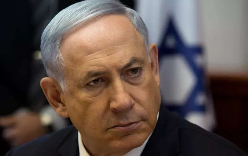 Israeli Prime Minister Benjamin Netanyahu looks on during the weekly cabinet meeting in his Jerusalem office, on April 19, 2015. AFP PHOTO / POOL / MENAHEM KAHANA