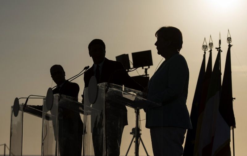 A handout picture released by Bundesregierung, the Cabinet of Germany shows (From L) French President Francois Hollande, Italian Prime Minister Matteo Renzi, and German Chancellor Angela Merkel giving a joint press conference aboard the Garibaldi aircraft carrier on the Italian island of Ventotene, on August 22, 2016, ahead of a meeting, to discuss the post-Brexit EU.
Europe's economic outlook, jihadist attacks, the refugee and migrant drama, the Syrian conflict, and relations with Russia and Turkey were all on the agenda for the talks later Monday on the island of Ventotene, one of the cradles of the European dream. / AFP PHOTO / Bundesregierung / Guido Bergmann / RESTRICTED TO EDITORIAL USE - MANDATORY CREDIT "AFP PHOTO / GUIDO BERGMANN / BUNDESREGIERUNG" - NO MARKETING - NO ADVERTISING CAMPAIGNS - DISTRIBUTED AS A SERVICE TO CLIENTS - NO ARCHIVE