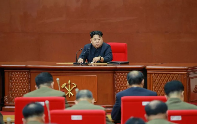 This undated picture released from North Korea's official Korean Central News Agency (KCNA) on August 28, 2015 shows North Korean leader Kim Jong-Un (C) attending an enlarged meeting of the Central Military Commission of the Workers' Party of Korea (WPK) at an undisclosed location in North Korea. North Korean leader Kim Jong-Un said nuclear weapons -- not negotiating skills -- secured what he described as a "landmark" agreement this week with South Korea to end a dangerous military standoff.      REPUBLIC OF KOREA OUT     AFP PHOTO / KCNA via KNS    
THIS PICTURE WAS MADE AVAILABLE BY A THIRD PARTY. AFP CAN NOT INDEPENDENTLY VERIFY THE AUTHENTICITY, LOCATION, DATE AND CONTENT OF THIS IMAGE. THIS PHOTO IS DISTRIBUTED EXACTLY AS RECEIVED BY AFP.
---EDITORS NOTE--- RESTRICTED TO EDITORIAL USE - MANDATORY CREDIT "AFP PHOTO / KCNA VIA KNS" - NO MARKETING NO ADVERTISING CAMPAIGNS - DISTRIBUTED AS A SERVICE TO CLIENTS