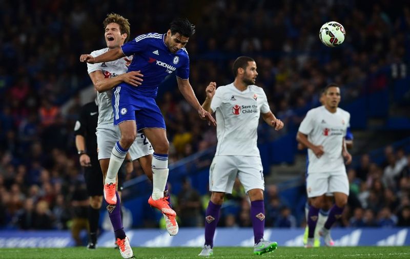 Fiorentina's Spanish defender Marcos Alonso (L) contests a header with Chelsea's Colombian striker Radamel Falcao (2L) during the pre-season friendly International Champions Cup football match between Chelsea and Fiorentina at Stamford Bridge in London on August 5, 2015.  AFP PHOTO / BEN STANSALL

RESTRICTED TO EDITORIAL USE. NO USE WITH UNAUTHORIZED AUDIO, VIDEO, DATA, FIXTURE LISTS, CLUB/LEAGUE LOGOS OR LIVE SERVICES. ONLINE IN-MATCH USE LIMITED TO 45 IMAGES, NO VIDEO EMULATION. NO USE IN BETTING, GAMES OR SINGLE CLUB/LEAGUE/PLAYER PUBLICATIONS.