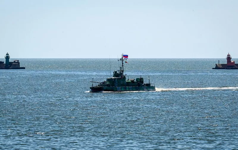 A Russian military coastguard ship patrols the sea port in the city of Mariupol on June 12, 2022, amid the ongoing Russian military action in Ukraine. (Photo by Yuri KADOBNOV / AFP)