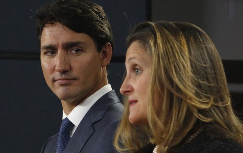 Canada's Prime Minister Justin Trudeau (L) and Minister of Foreign Affairs Chrystia Freeland (R) speak at a press conference to announce the new trade with between Canada, the United States, and Mexico in Ottawa, October 1, 2018. - Trudeau hailed a continental trade deal reached with the United States, along with Mexico, as "profoundly beneficial" to Canadians. "It is an agreement that will be profoundly beneficial for our economy, for Canadian families and for the middle class," Trudeau told a news conference hours after a new US-Mexico-Canada Agreement was reached in the eleventh-hour overnight talks. (Photo by PATRICK DOYLE / AFP)