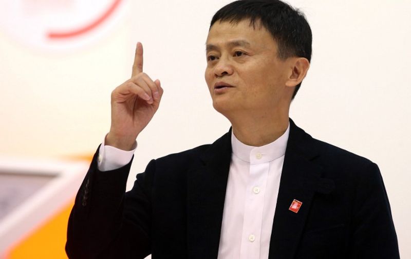 Jack Ma, founder and CEO of Chinese internet company Alibaba Group, stands at the exhibition stand of his company at the computer fair CeBIT in Hanover, Germany, 16 March 2015. The world's biggest computer fair CeBIT runs until 20 March 2015, partner country is China. PHOTO: CHRISTIAN CHARISIUS/dpa