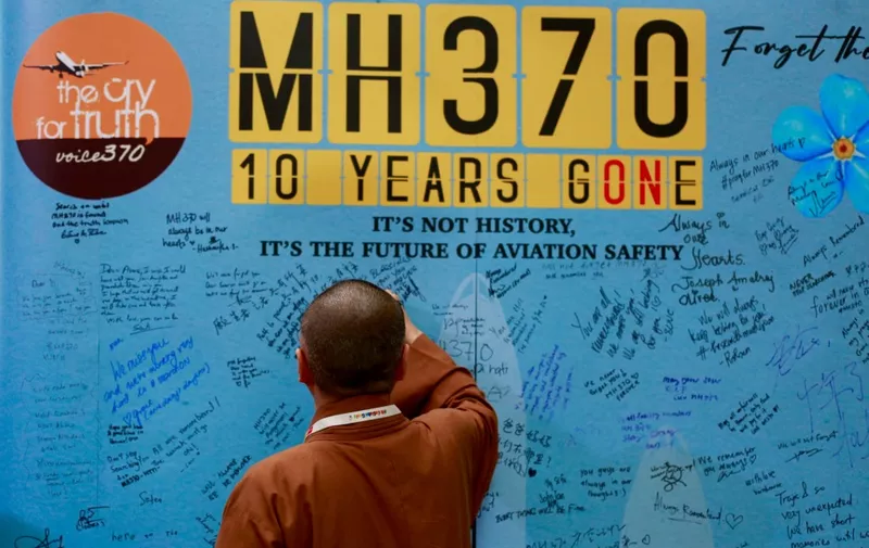 Visitors are writing messages at the Day of Remembrance for MH370 in Petaling Jaya, Malaysia, on March 3, 2024. Today marks the 10th anniversary of the disappearance of Flight MH370, a Boeing 777 aircraft with 239 people on board, which vanished from radar screens on March 8, 2014, while flying from Kuala Lumpur to Beijing. (Photo by Supian Ahmad/NurPhoto) (Photo by Supian Ahmad / NurPhoto / NurPhoto via AFP)