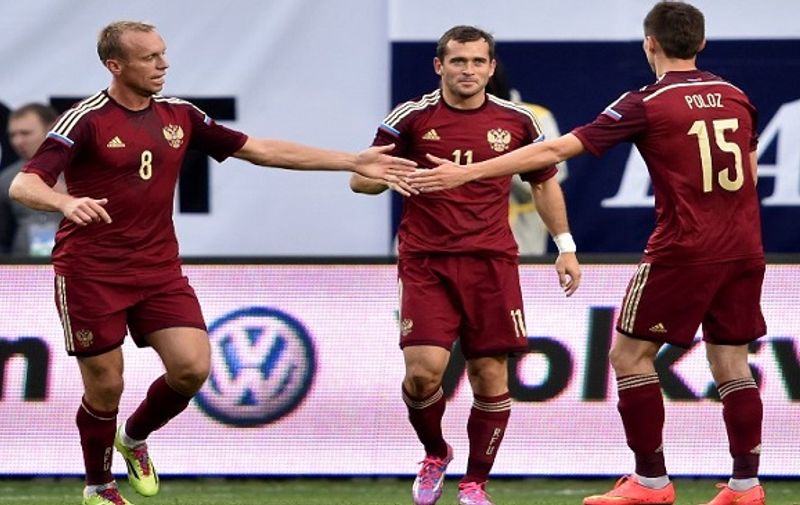Russia's Aleksandr Kerzhakov (C) celebrates with teammates after scoring during the friendly football match Russia vs Azerbaijan in Khimki outside Moscow on September 3, 2014. AFP PHOTO/KIRILL KUDRYAVTSEV