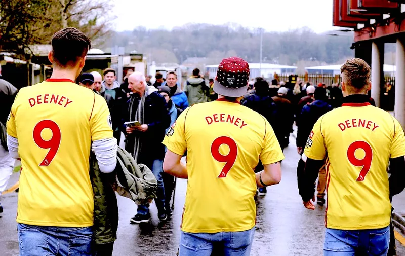 Three Watford fans wear Troy Deeney shirts before the Premier League match at Vicarage Road, London. PRESS ASSOCIATION Photo. Picture date: Saturday March 31, 2018. See PA story SOCCER Watford. Photo credit should read: Mark Kerton/PA Wire. RESTRICTIONS: EDITORIAL USE ONLY No use with unauthorised audio, video, data, fixture lists, club/league logos or &#8220;live&#8221; services. [&hellip;]