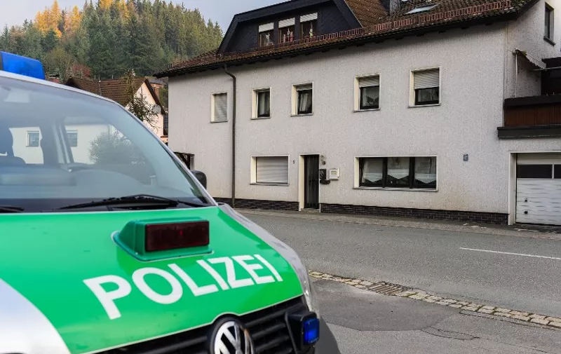 A police car stands on November 13, 2015 in front of a house in Wallenfels, southern Germany, where the bodies of "several" infants were discovered the day before. The bodies were found during a visit by emergency services, police said, but did not give any details of the circumstances of their deaths or how many bodies were found.     AFP PHOTO / DPA / NICOLAS ARMER   +++   GERMANY OUT   +++