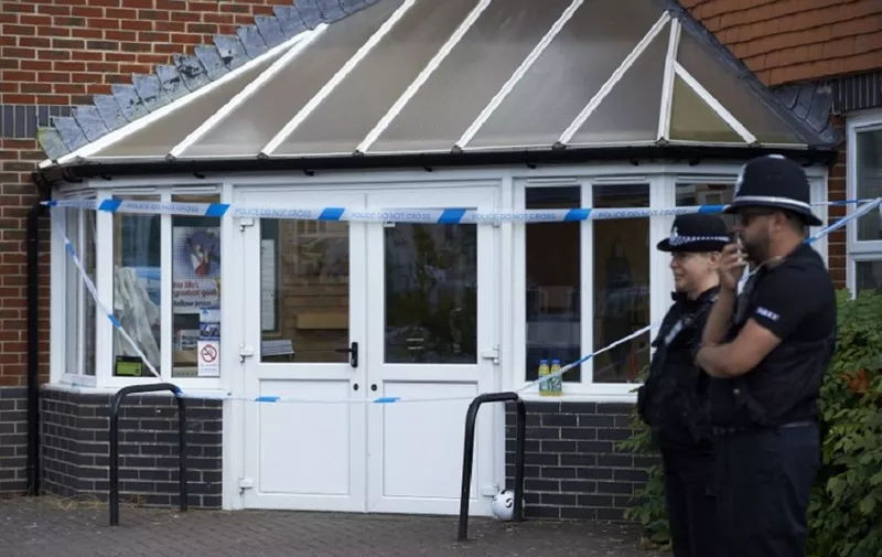 Police officers stand guard outside Amesbury Baptist Centre in Amesbury, southern England, on July 7, 2018.
The exposure of an apparently random British couple to the same nerve agent used against former Russian double agent Sergei Skripal, in the same part of southwest England, has sent officials scrambling to discover the source of the contamination. / AFP PHOTO / NIKLAS HALLE'N