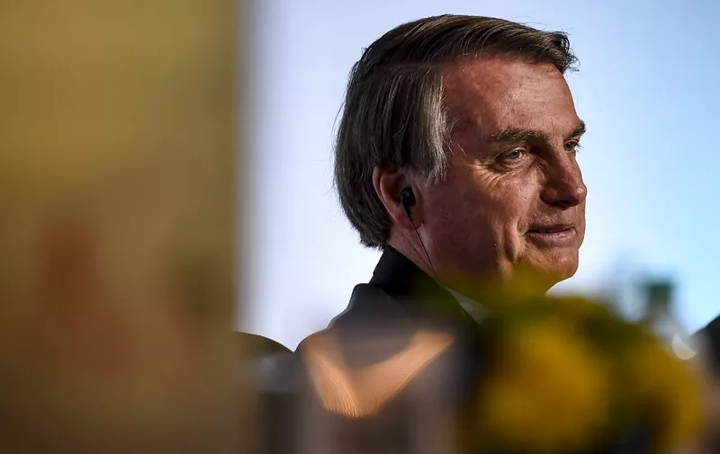 Brazil's President Jair Bolsonaro looks on as he attends the India-Brazil Business Forum meeting in New Delhi on January 27, 2020. (Photo by Money SHARMA / AFP)