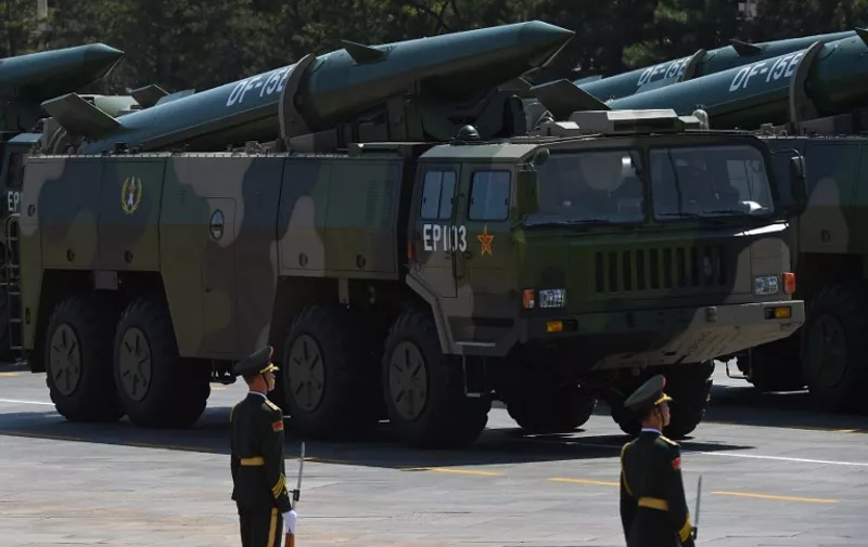 Military vehicles carrying DF-15B ballistic missiles participate in a military parade at Tiananmen Square in Beijing on September 3, 2015, to mark the 70th anniversary of victory over Japan and the end of World War II. China kicked off a huge military ceremony marking the 70th anniversary of Japan's defeat in World War II on September 3, as major Western leaders stayed away. AFP PHOTO / GREG BAKER / AFP PHOTO / GREG BAKER