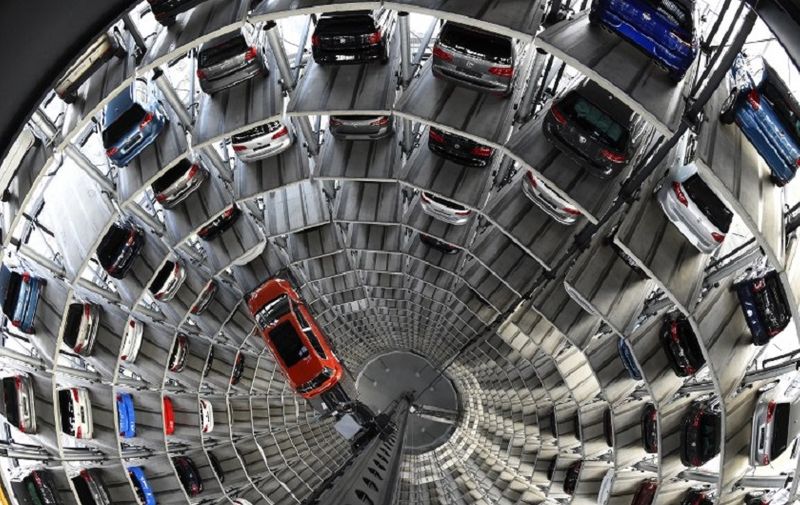 A VW Golf is pictured inside the so-called cat towers of car manufacturer Volkswagen AG (VW) at the company's assembly plant in Wolfsburg, northern Germany on March 10, 2015. AFP PHOTO / TOBIAS SCHWARZ