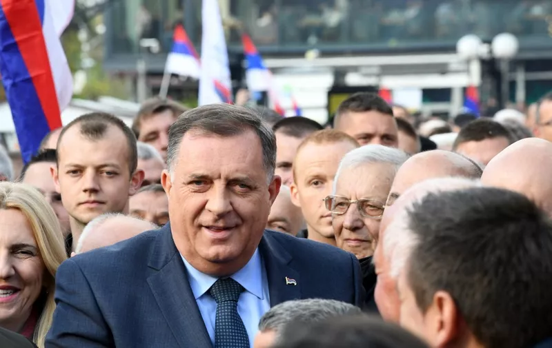 Bosnian Serb political leader Milorad Dodik stands among supporters as they gather in centre of the northern Bosnian town of Banja Luka, Republika Srpska, on April 20, 2022, during a rally to "defend Republika Srpska", the Bosnian Serb entity. People rallied in Banja Luka to show support for Bosnian-Serb leadership and against a decision made by the International Community's High Representative to Bosnia and Herzegovina regarding recent laws passed by the Bosnia-Serb National Assembly, which they deem to be in violation of the country's constitution and aimed towards the discreditation of the state's central institutions. (Photo by ELVIS BARUKCIC / AFP)