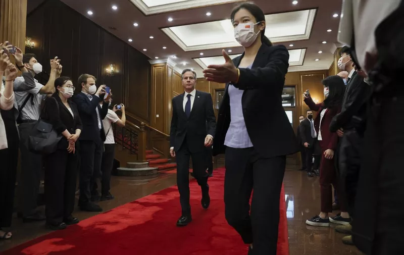 US Secretary of State Antony Blinken (background C) walks as he arrives to meet with China's Director of the Office of the Central Foreign Affairs Commission Wang Yi (not pictured) at the Diaoyutai State Guesthouse in Beijing on June 19, 2023. (Photo by LEAH MILLIS / POOL / AFP)