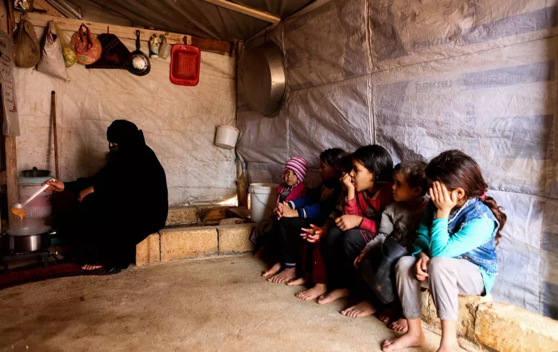 December 20, 2018 - Internally displaced Syrians in the Wadi Al-Adheb camp near the Al-Dana town in northwestern Syria face cold weather, rain, floods, as well as food and water shortages.  The residents of the camp are originally from the town of Al-Aqirabat in Eastern Hama, and they moved to the Wadi Al-Adheb town in the Hama governorate during fighting in Al-Aqirabat. During the Syrian governmentâ€™s military offensive against Isis in 2016, they remained under siege in Wadi Al-Adheb for 45 days before fleeing to the countryside of Al-Dana in Idlib. Their camp in Dana is called Wadi Al-Adheb in memory of their siege. With nearly 7 million people displaced in Syria, including around 3 million children, according to the UN Syrian internally displaced population represent the biggest internally displaced population in the world, Image: 403834240, License: Rights-managed, Restrictions: , Model Release: no, Credit line: Profimedia, Zuma Press - News
