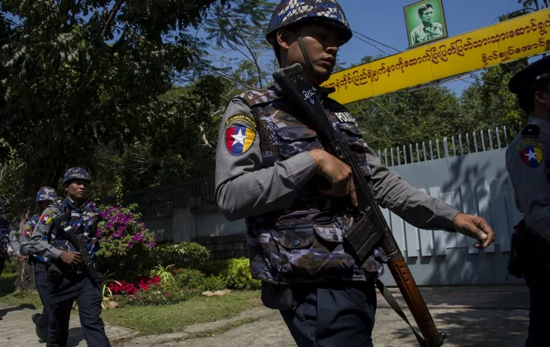 Police officers patrol in front of the residence of Myanmar's leader Aung San Suu Kyi in Yangon on February 1, 2018, after a petrol bomb was hurled into the compound. - A man threw a petrol bomb at the lakeside Yangon compound of Myanmar's leader Aung San Suu Kyi on February 1, officials said, a rare attack on a national figurehead who draws widespread support inside the country despite global outcry of her reticence to speak up for the Rohingya. (Photo by YE AUNG THU / AFP)