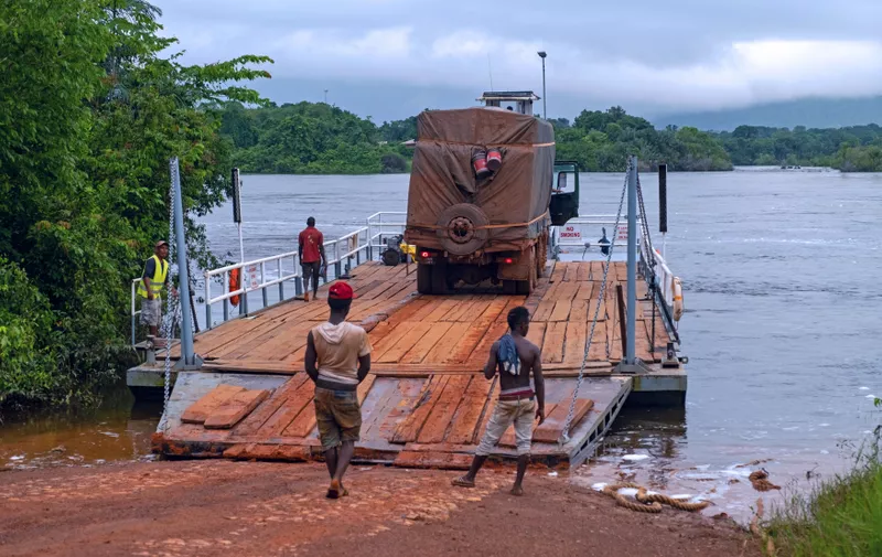 Truck on ferry boat crossing the Essequibo river in the rainy season along the Linden-Lethem dirt road, Guyana, South America,Image: 781838251, License: Rights-managed, Restrictions: , Model Release: no