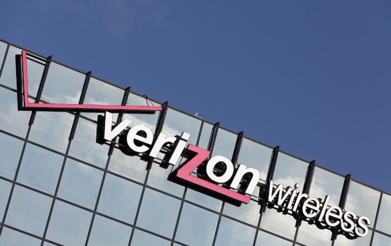Corporate logo of Verizon wireless on the mirrored-glass of an office building, in April 2013.