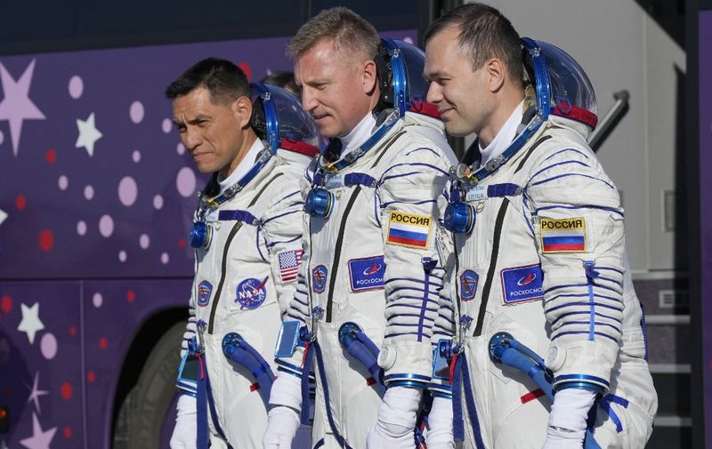 Russian cosmonauts Sergey Prokopyev (2R) and Dmitri Petelin (R) and NASA astronaut Frank Rubio, members of the International Space Station (ISS) Expedition 68 main crew, arrive to board the Soyuz MS-22 spacecraft prior to the launch at the Russian leased Baikonur cosmodrome in Kazakhstan on September 21, 2022. (Photo by Dmitry LOVETSKY / POOL / AFP)