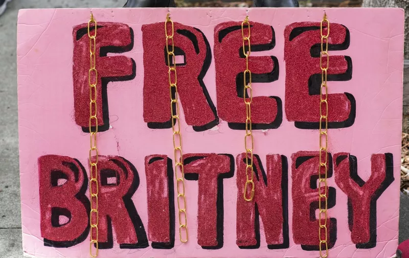 A placard is pictured in front of the courthouse during the FreeBritney movement rally in support of musician Britney Spears following a conservatorship court hearing in Los Angeles, California on April 27, 2021. - Britney Spears has requested to speak in court in the legal battle over her father's control of her affairs, her attorney said April 27, 2021. The 39-year-old US pop singer is the subject of a "FreeBritney" online campaign from her adoring fans who believe the guardianship in place since 2008 should be ended, but has rarely spoken directly about the issue herself. (Photo by VALERIE MACON / AFP)