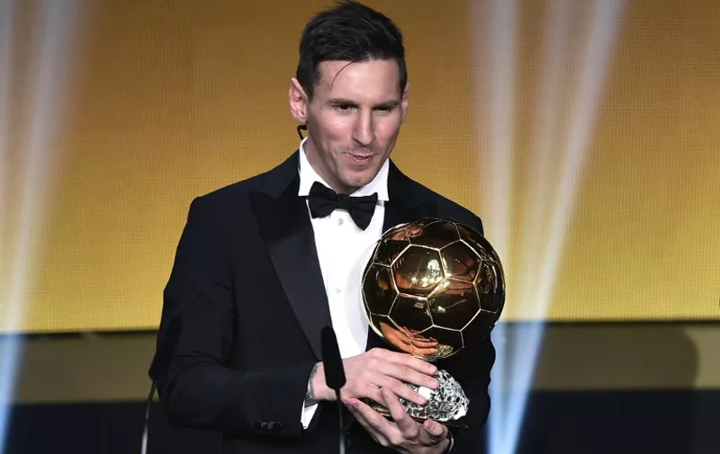 FC Barcelona and Argentina's forward  Lionel Messi holds his trophy after receiving the 2015 FIFA Ballon dOr award for player of the year during the 2015 FIFA Ballon d'Or award ceremony at the Kongresshaus in Zurich on January 11, 2016. AFP PHOTO / FABRICE COFFRINI / AFP / FABRICE COFFRINI