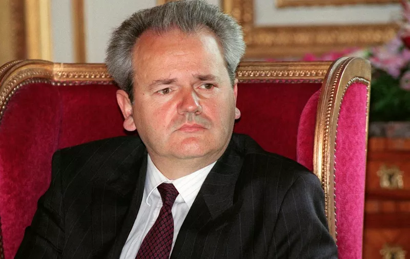 Portrait of Yugoslav federation President Slobodan Milosevic taken in Paris 29 August 1991 in a Paris Palace during a press conference. Milosevic has died in the UN war crimes tribunal's detention center in the Hague, Radio B92 reported 11 March 2006. Milosevic was standing trial at the Hague-based UN war crimes court on more than 60 counts including genocide and crimes against humanity for his role in the Balkan wars, including the 1995 massacre of 8,000 Muslims at Srebrenica. (Photo by FRANCOIS XAVIER MARIT / AFP)