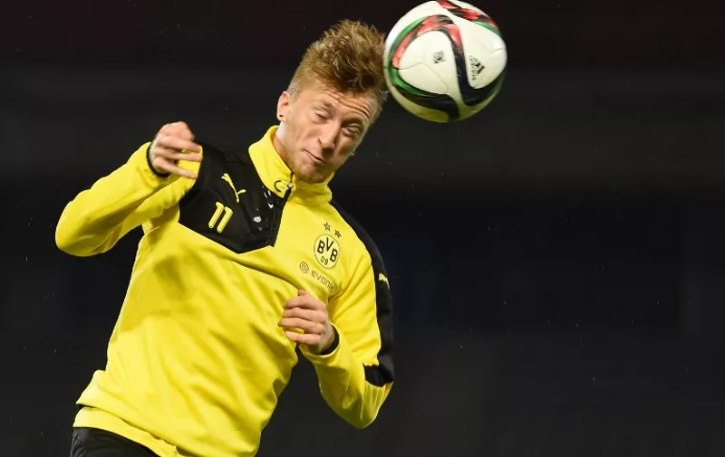 Forward Marco Reus of Germany's football club Borussia Dortmund heads a ball during a training session after their arrival in Japan in Kawasaki, suburb of Tokyo on July 6, 2015.  Borussia Dortmund will play a friendly match with Japan's club Kawasaki Frontale on July 7.     AFP PHOTO / Toru YAMANAKA