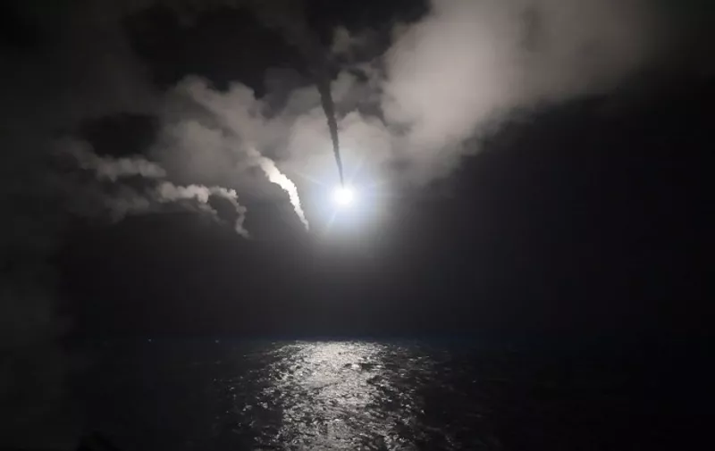 In this image released by the US Navy, the guided-missile destroyer USS Porterconducts strike operations while in the Mediterranean Sea, April 7, 2017. 
US President Donald Trump ordered a massive military strike on a Syrian air base on Thursday in retaliation for a "barbaric" chemical attack he blamed on President Bashar al-Assad. / AFP PHOTO / US NAVY / Ford WILLIAMS / RESTRICTED TO EDITORIAL USE - MANDATORY CREDIT "AFP PHOTO / US NAVY / Mass Communication Specialist 3rd Class Robert S. Price" - NO MARKETING NO ADVERTISING CAMPAIGNS - DISTRIBUTED AS A SERVICE TO CLIENTS