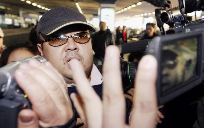 This photo taken on February 11, 2007 shows a man believed to be then-North Korean leader Kim Jong-Il's eldest son, Kim Jong-Nam, walking amongst journalists upon his arrival at Beijing's international airport.
The half-brother of North Korean leader Kim Jong-Un, who has been murdered in Malaysia, pleaded for his life after a failed assassination bid in 2012, lawmakers briefed by South Korea's spy chief said on February 15, 2017. / AFP PHOTO / JIJI PRESS / JIJI PRESS / Japan OUT