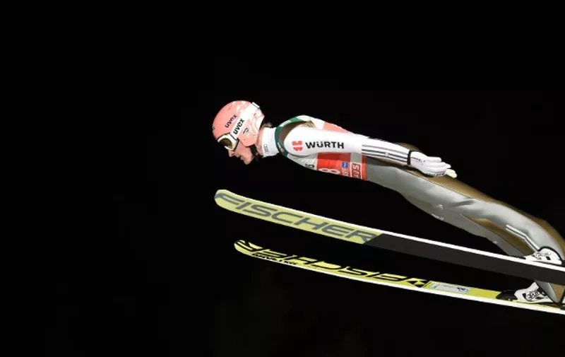 Germany's Severin Freund soars through the air during his qualification jump of the ski jumping event in Oberstdorf, southern Germany, which is the first station of the Four-Hills Ski Jumping tournament (Vierschanzentournee), on December 28, 2015.
The first competition of the Four-Hills Ski jumping event takes place in Oberstdorf, before the tournament continues in Garmisch-Partenkirchen (Germany), in Innsbruck (Austria) and in Bischofshofen (Austria). / AFP / Christof STACHE