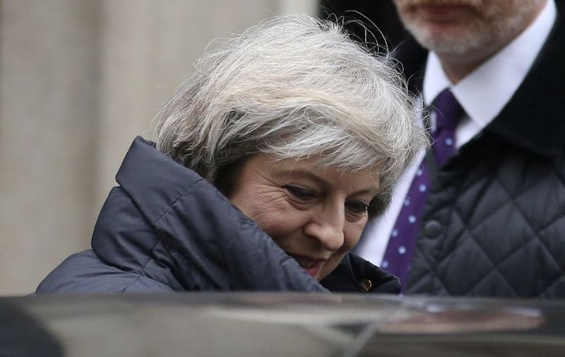 Britain's Prime Minister Theresa May leaves 10 Downing Street in central London on January 25, 2017 to attend the weekly Prime Minister's Questions in the House of Commons.
May was set to answer MP's question at Parliament a day after The Supreme Court's landmark ruling that the government must win parliament's approval before starting talks for Britain to leave the European Union. May will this week be the first foreign leader to meet with Donald Trump since his inauguration, aiming to discuss a key post-Brexit trade deal with the US.  / AFP PHOTO / Daniel LEAL-OLIVAS