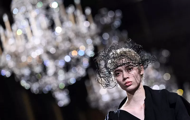 A model presents a creation from Yohji Yamamoto Womenswear Fall-Winter 2023-2024 collection during Paris Fashion Week in Paris, on March 3, 2023. (Photo by Emmanuel DUNAND / AFP)