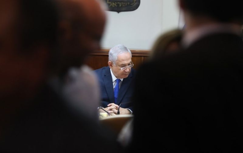 Israeli Prime Minister Benjamin Netanyahu attends a weekly cabinet meeting in Jerusalem on July 9, 2017. / AFP PHOTO / POOL / Dan Balilty