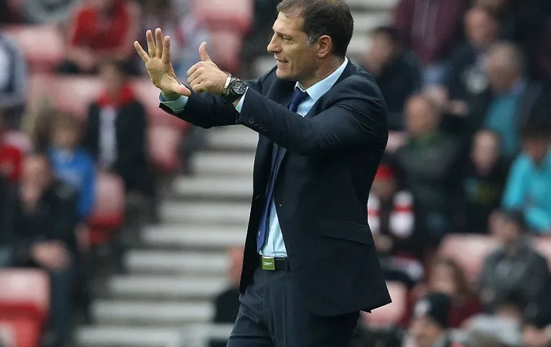 West Ham United's Croatian manager Slaven Bilic gestures on the touchline during the English Premier League football match between Sunderland and West Ham United at the Stadium of Light in Sunderland, north east England on October 3, 2015. AFP PHOTO / LINDSEY PARNABY

RESTRICTED TO EDITORIAL USE. No use with unauthorized audio, video, data, fixture lists, club/league logos or 'live' services. Online in-match use limited to 75 images, no video emulation. No use in betting, games or single club/league/player publications.