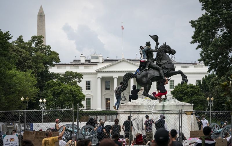 WASHINGTON, DC - JUNE 22: Protesters attempt to pull down the statue of Andrew Jackson in Lafayette Square near the White House on June 22, 2020 in Washington, DC. Protests continue around the country over police brutality, racial injustice and the deaths of African Americans while in police custody.   Drew Angerer/Getty Images/AFP