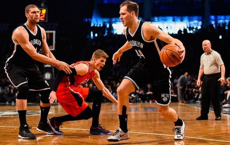 NEW YORK, NY - APRIL 25:  #44 of the Brooklyn Nets attempts to drive past teammate Brook Lopez #11 and Kyle Korver #26 of the Atlanta Hawks during the first round of the 2015 NBA Playoffs at Barclays Center on April 25, 2015 in the Brooklyn borough of New York City. NOTE TO USER: User expressly acknowledges and agrees that, by downloading and/or using this photograph, user is consenting to the terms and conditions of the Getty Images License Agreement.   /AFP