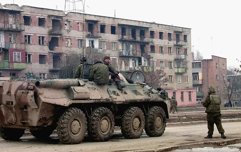 An APC of the Russian federal troops patrols the streets of Chechnya's second biggest city of Gudermes, 12 November, 1999, after Russian troops flushed out Chechen separatist fighters. (Photo by ITAR-TASS / AFP)