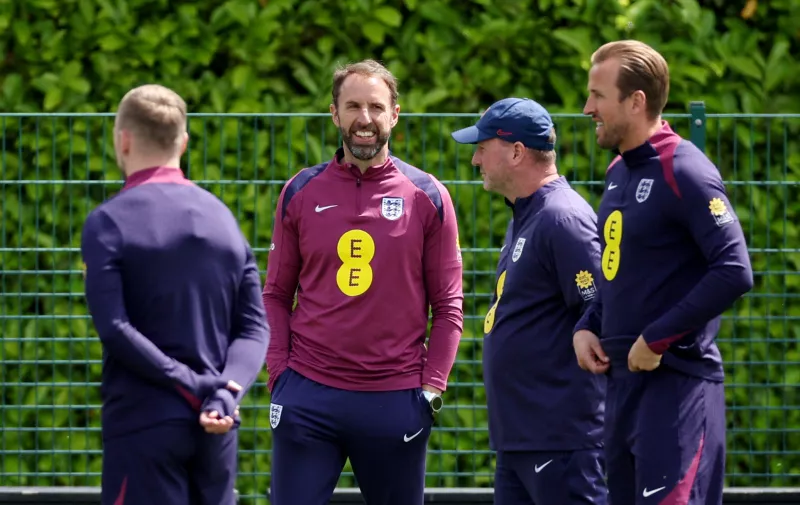 Soccer Football - International Friendly - England Training - Tottenham Hotspur Training Centre, London, Britain - June 6, 2024 England manager Gareth Southgate, assistant manager Steve Holland and Harry Kane during training Action Images via Reuters/Andrew Boyers