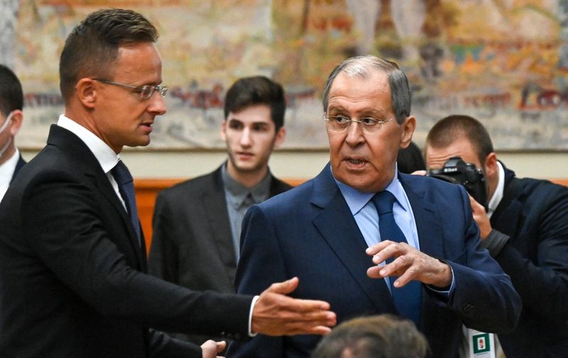Russian Foreign Minister Sergey Lavrov (R) chats with Hungary's Foreign and Trade Minister Peter Szijjarto (L) prior to their joint press conference in Budapest, Hungary on August 24, 2021. - Lavrov is on a one-day working visit in Hungary. (Photo by Attila KISBENEDEK / AFP)