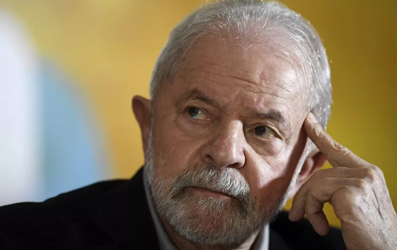 Former Brazilian President Luiz Inacio Lula da Silva gestures during a meeting with members of the Rede Party in Brasilia, on April 28, 2022, to discuss the party's support for his candidacy in the upcoming October elections. - The UN Human Rights Committee based in Geneva, concluded on April 28, 2022 that former Brazilian president Luiz Inacio Lula da Silva had his right to be tried by an impartial tribunal violated in the anti-corruption Lava Jato (Car Wash) operation, after examining a complaint filed by the leftist's defence. (Photo by EVARISTO SA / AFP)