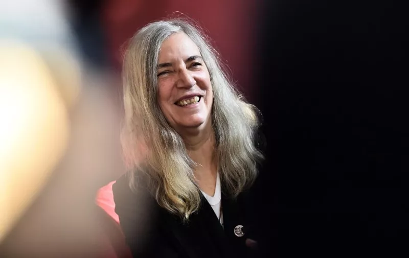 US singer Patti Smith gives an interview on December 3, 2015 in Paris, within the United Nations conference on climate change , or COP21. / AFP PHOTO / LOIC VENANCE