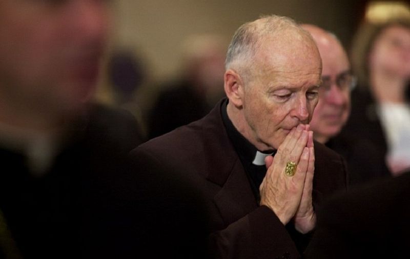 Archbishop of Washington Cardinal Theodore McCarrick prays during a prayer for deceased bishops 11 November 2002 at the start of the morning session of the US Conference of Catholic Bishops being held in the Capitol Hyatt in Washington, DC. The US Conference of Catholic Bishops met here 11 November to revise its policy on pedophile priests after the Vatican rejected their first "zero tolerance" recommendation to dismiss any one accused of such crimes. Under pressure of a Vatican veto, for the next four days in a Washington hotel, 288 bishops, including eight cardinals, will try to negotiate a new, more lenient text than they approved last June in Texas.         AFP PHOTO/Shawn THEW (Photo by SHAWN THEW / AFP)