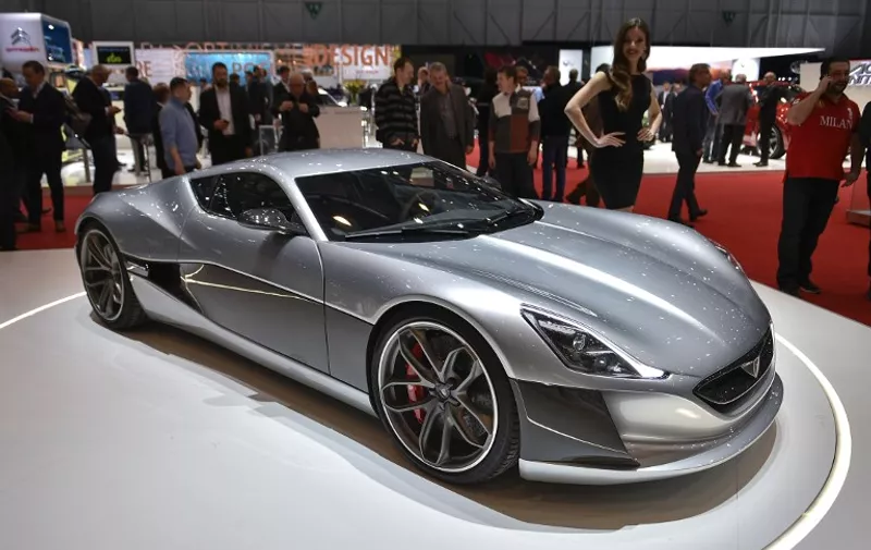 The production version of the Rimac Concept One electric car is displayed at the stand of Croatian carmaker during the press day of the Geneva Motor Show on March 2, 2016 in Geneva. / AFP / FABRICE COFFRINI