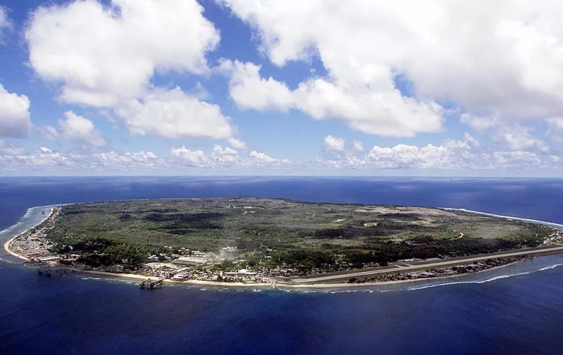 The barren and bankrupt island state of the Republic of Nauru awaits the arrival of 521 mainly Afghan refugees, 11 September 2001 which have been refused entry into Australia.  The 25-square-kilometers of land encompassing Nauru has been devastated by phosphate mining which once made the Micronesian Nauruans the second wealthiest people per capita on earth.          AFP PHOTO/Torsten BLACKWOOD (Photo by TORSTEN BLACKWOOD / AFP)