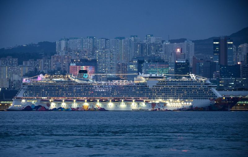 A general view shows the World Dream cruise ship, docked at the Kai Tak cruise terminal in Hong Kong on February 6, 2020, as health officials conduct inspections in the wake of the SARS-like virus outbreak across China. - China's coronavirus crisis deepened on February 6 with the death toll soaring to 563, as thousands of people trapped on quarantined cruise ships added to the global panic about the epidemic. In Hong Kong, 3,600 people were preparing to spend a second night confined aboard the World Dream as authorities conducted health checks after eight former passengers tested positive for the virus. (Photo by Philip FONG / AFP)