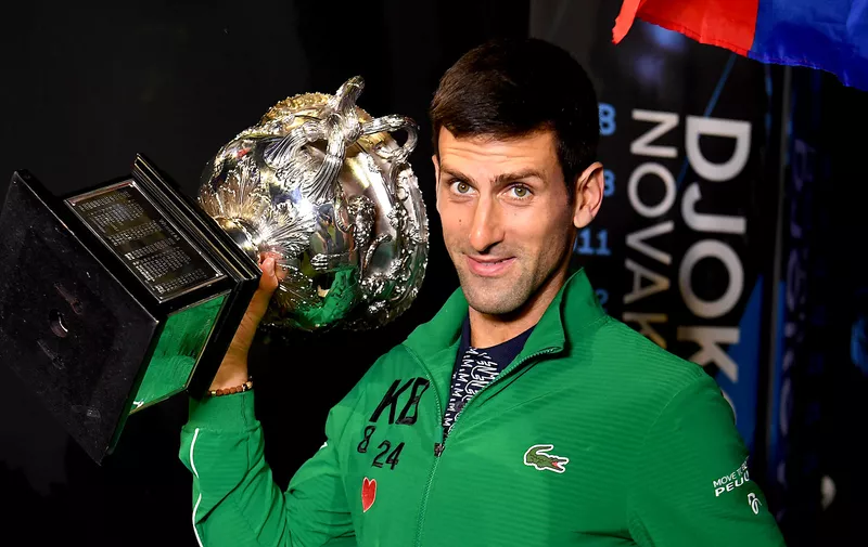 MELBOURNE, AUSTRALIA - FEBRUARY 02: Novak Djokovic of Serbia walks onto Margaret Court Arena holding the Norman Brookes Challenge Cup after winning the Men's Singles Final against Dominic Thiem of Austria on day fourteen of the 2020 Australian Open at Melbourne Park on February 02, 2020 in Melbourne, Australia. (Photo by Morgan Hancock/Getty Images)