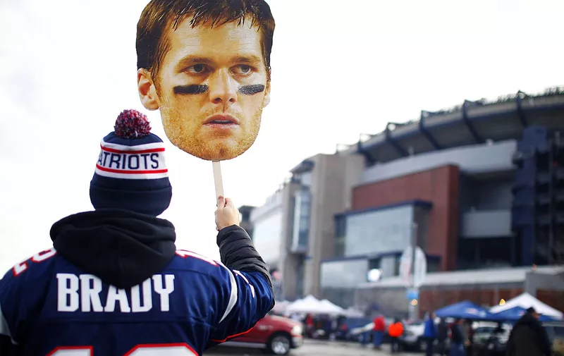 A New England Patriots fan walks around the parking lot of Gillette Stadium with a large cardboard cutout photo of quarterback Tom Brady prior to the the AFC Divisional Playoff game against the Kansas City Chiefs in Foxborough, Massachusetts, on January 16, 2016. Photo by / UPI, Image: 307261977, License: Rights-managed, Restrictions: , Model Release: [&hellip;]