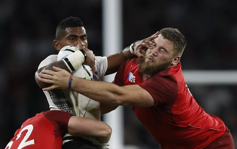 Fiji's scrum-half Nikola Matawalu is blacked by England's prop Kieran Brookes  during a Pool A match of the 2015 Rugby World Cup between England and Fiji at Twickenham stadium in south west London on September 18, 2015. AFP PHOTO / ADRIAN DENNIS

RESTRICTED TO EDITORIAL USE, NO USE IN LIVE MATCH TRACKING SERVICES, TO BE USED AS NON-SEQUENTIAL STILLS