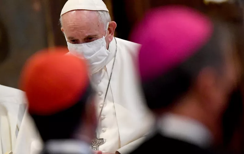 Pope Francis, wearing a protective face mask attends an inter-religious prayer service for peace along with other religious representatives in the Basilica of Santa Maria in Aracoeli, a church on top of Rome's Capitoline Hill, on October 20, 2020 in Rome. (Photo by Andreas SOLARO / AFP)
